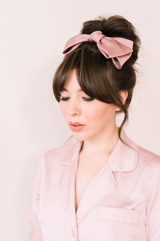a dusty pink oversized silk bow is a cool accessory for a super feminine and cute look every day