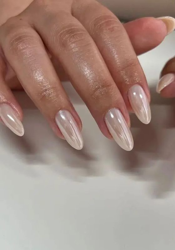 delicate soft neutral chrome nails, long and of an almond shape, will be a gorgeous solution for many outfits