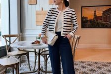 19 a classic old money outfit with a white t-shirt, a striped cardigan, navy pants, tan shoes and a small white bag