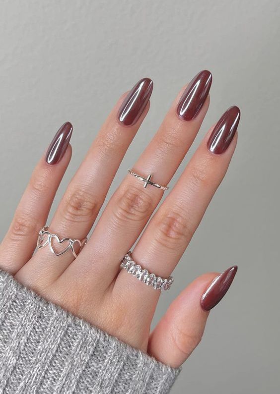 chocolate glazed donut nails of an almond shape are a cool idea for a fall or winter outfit