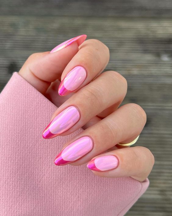 a super bold French manicure on stiletto nails done in lights and hot pink is inspired by Barbie