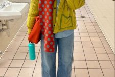 25 a bright outfit with a chambray shirt, wideleg jeans, a mustard jacket, a red printed scarf and an orange bag