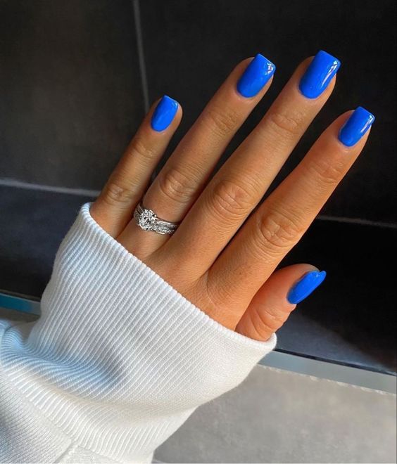 a bold and glossy electric blue manicure with a square shape is amazing for any season if you love blue