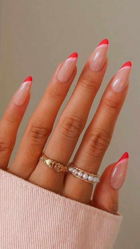 a bright and eye-catchy manicure, an alternative to French nails, done in blush, light pink and red