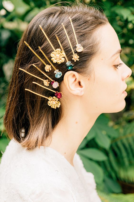 multiple floral and gemstone hairpins will make even a simple hairstyle bold and eye-catchy