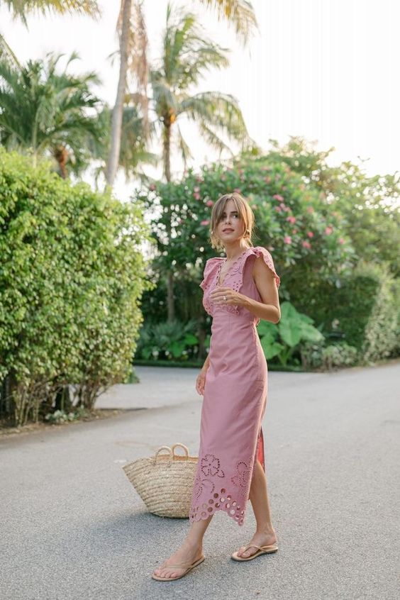a pretty feminine look for summer with a pink lace midi dress, flipflops and a woven tote is simple and cool