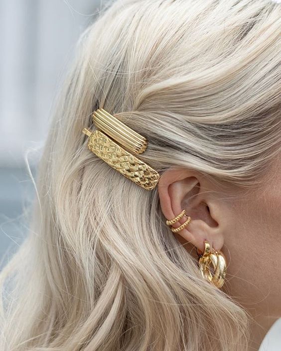a duo of beautiful statement gold hair pins is a stylish solution to accent your hairstyle in a glam way