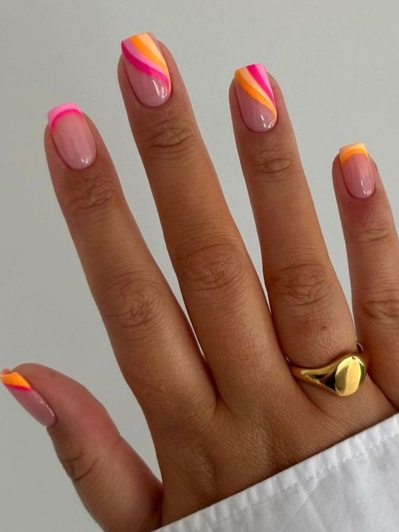 extra bold summer nails with yellow, orange, pink and hot pink and abstract ppatterns are amazing