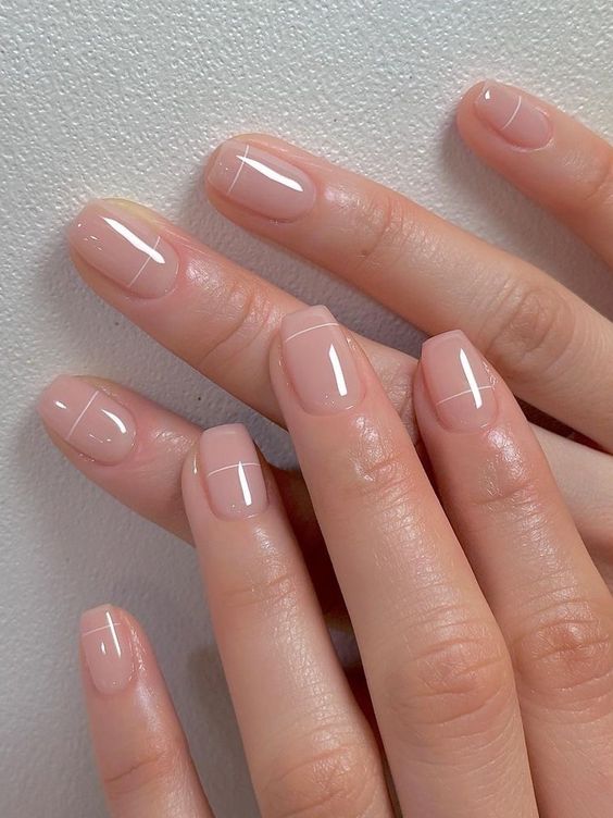 nude square nails with verythin white stripes are a cool idea for any modern look