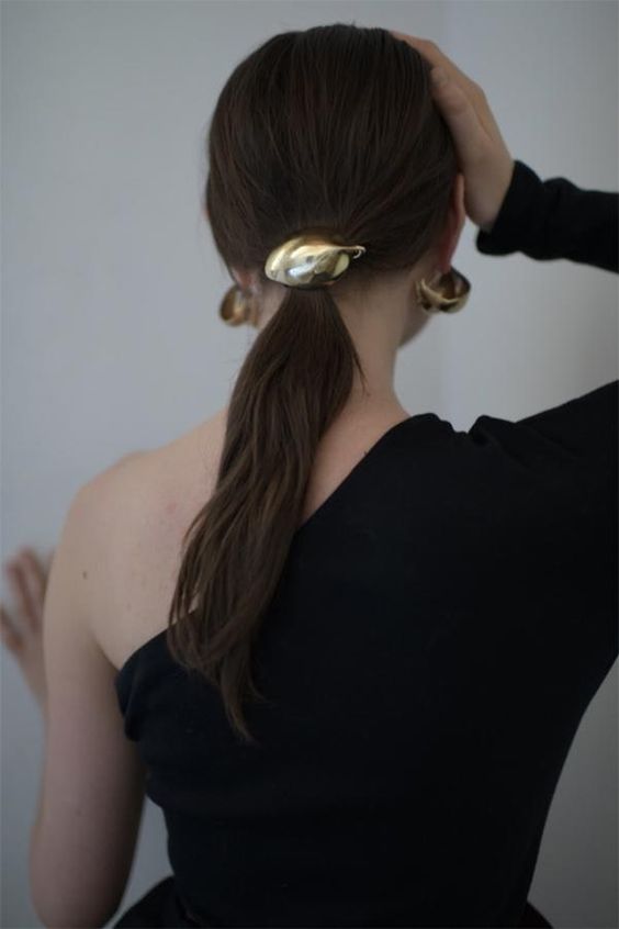 a luxurious metallic hair barrette and matching earrings are a nice combo to rock