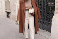 40 a chic and casual work look with a tan turtleneck, creamy pants and a bag, a brown coat and clear shoes