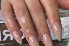 40 a chic long almond manicure done in an elegant nude shade is always a good idea for any occasion