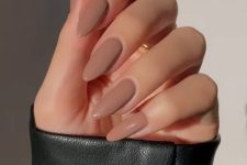 41 a delicate nude brownish shade accents the shape of the nails and looks elegant, brown is the new nude
