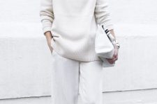 45 a white turtleneck sweater and pants, a large bag and sneakers for a comfy casual look