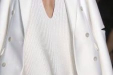 46 a white pencil skirt, an oversized plunging neckline chunky knit sweater and a white coat for a sexy look