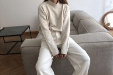 49 a simple and classy white look with a jumper, trousers and sneakers is all you need for every day