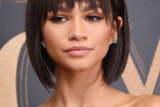 Zendaya rocking a black liqud bob with a feathered fringe and side bangs looks jaw-dropping
