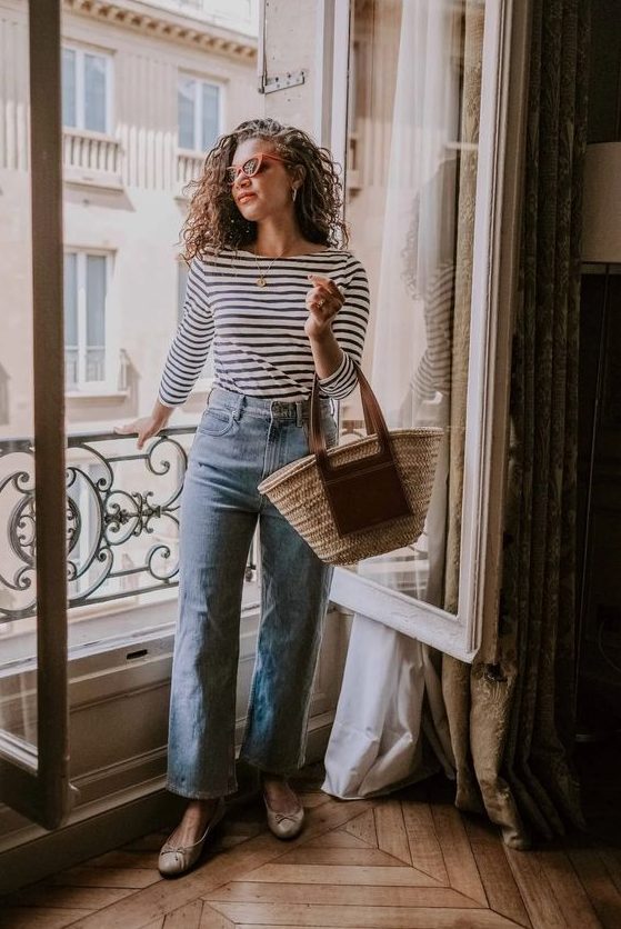 a Breton stripe top, blue jeans, nude flats, a straw bag are a lovely combo for a French chic spring or summer look