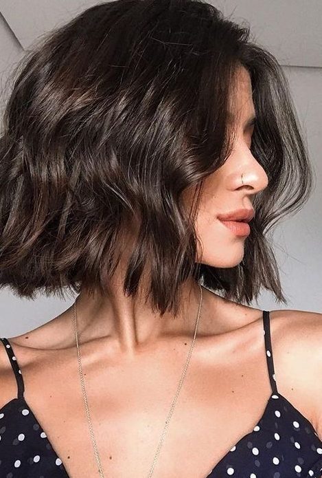 a beautiful and shiny chocolate brown long bob with a bit of waves is a lovely idea to go for