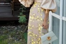 a beautiful off the shoulder midi fitting dress with a plain bodice, puff sleeves and a floral print skirt, lemon yellow shoes and statement earrings