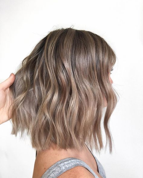 a beautiful shoulder-length light brown wavy bob is a cool idea, accent it with some bangs that you like