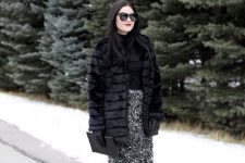 a black top, a black sequin pencil skirt, black tights, black shoes and a faux fur coat plus a clutch