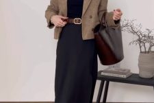 a black turtleneck, a black maxi skirt, black boots, a beige cropped blazer and a burgundy tote
