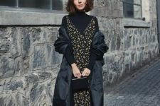 a black turtleneck, a moody floral midi dress over it, sock boots, a small bag and a puff midi coat