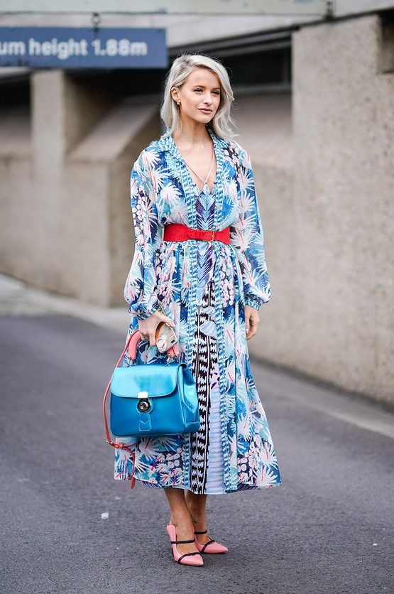 a bright blue midi printed dress, a red belt, pink shoes for a colorful spring wedding