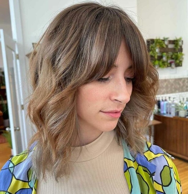 a bronde ombre long wavy bob with curtain fringe and highlights is a cool hairstyle with minimum effort