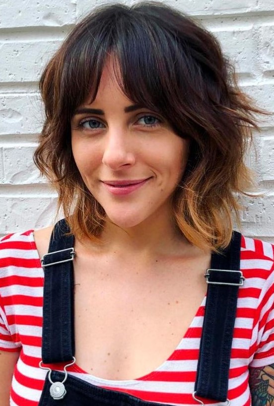 a catchy dark brunette long bob with bottleneck bangs and caramel ombre plus shaggy waves is a cool idea