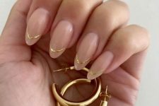 a chic and glam French wedding manicure with a gold touch is a lovely idea to look chic and wedding-appropriate
