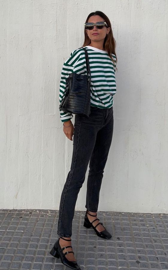a classy every day look with a striped long sleeve top, grey skinnies, black Mary Jane shoes and a black tote
