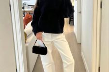 a contrasting outfit with a black jumper, white jeans, black flats and a small black bag is super simple