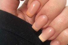 a cool French manicure with ombre tips from brown to orange, peachy and white is a lovely idea