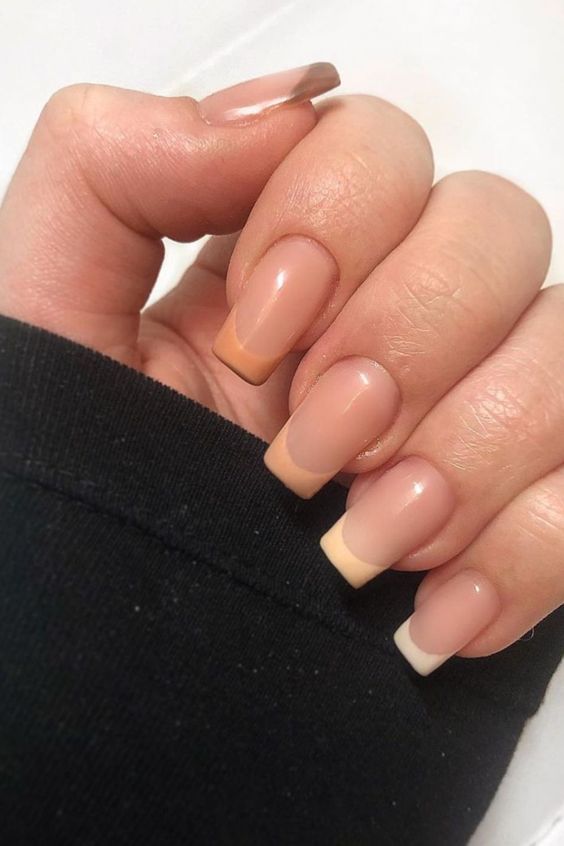 a cool French manicure with ombre tips from brown to orange, peachy and white is a lovely idea