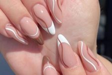 a cool and trendy swirl manicure with French nails and waves, done in nude, white and brown is wow