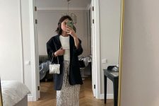 a cool party look with a white t-shirt, a silver sequin midi, a black oversized blazer and black shoes, a silver bag