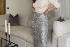 a cool pre-wedding party look with a white turtleneck, a silver sequin midi, silver bow shoes is lovely