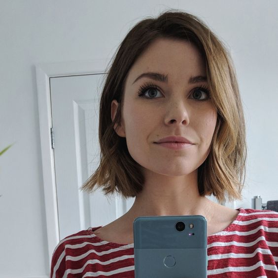 a cute midi light brunette bob with side parting adn wavy ends is a cool and catchy hairstyle idea