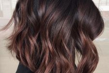 a dark brown long bob with copper balayage, waves and volume, is a catchy and cool solution for the fall