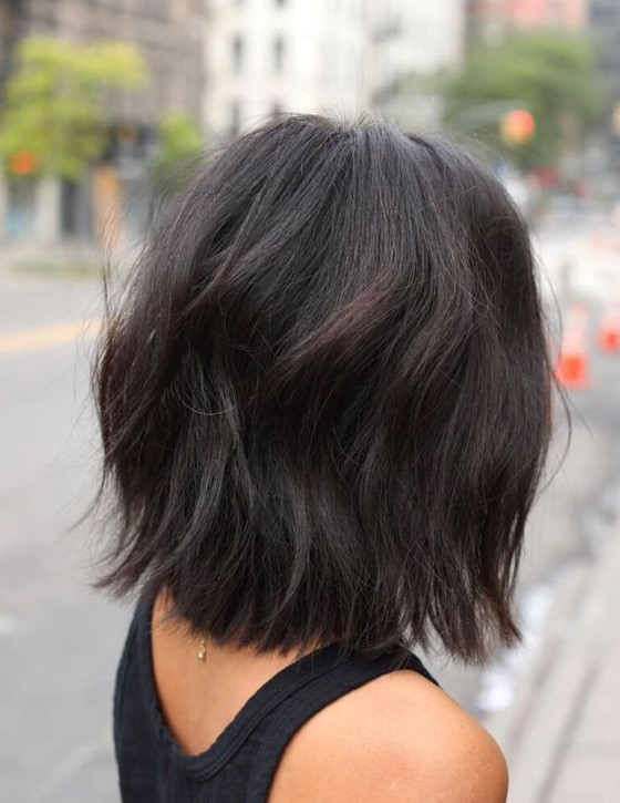 a dark brunette long bob with volume, dimension and waves is a catchy and cool idea to rock