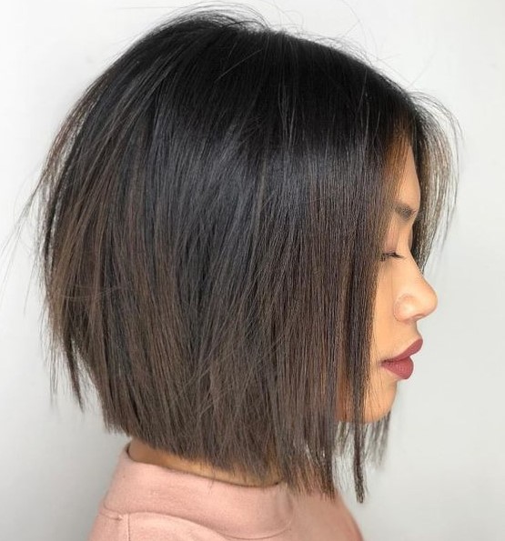 a dark brunette midi bob with volume and texture is a cool and catchy idea to try, add some highlights