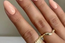 a delicate pastel manicure with lilac and Peach Fuzz nails and gold touches are amazing for spring and summer