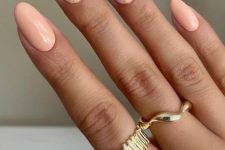 a delicate pastel manicure with lilac and Peach Fuzz nails and gold touches are amazing for spring and summer