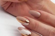 a fantastic nude, gold and white abstract manicure is a very chic and glam idea for a glam modern bride