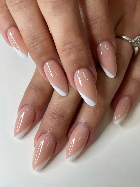 a fresh take on French manicure, dusty pink almond nails with white touches is a gorgeous solution for a wedding