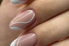 a fresh take on French manicure with white swirls and tips, is a very stylish and ultra-modern idea