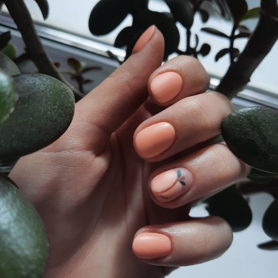 a funny matte Peach Fuzz manicure with a peach accent nail are a cute and sweet idea for summer