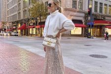 a glam pre-wedding party look with a white oversized sweater, a silver sequin A-line skirt, nude shoes and a white bag
